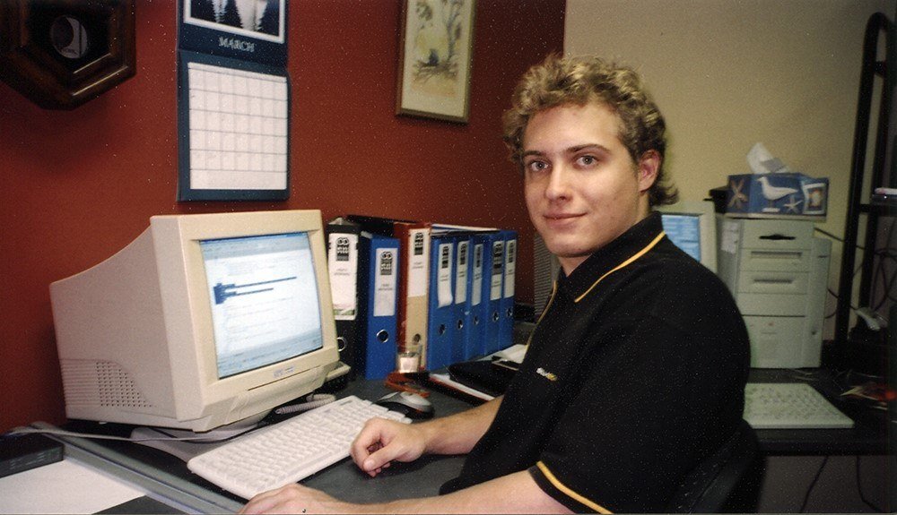 Nick at his computer in his early days of building websites