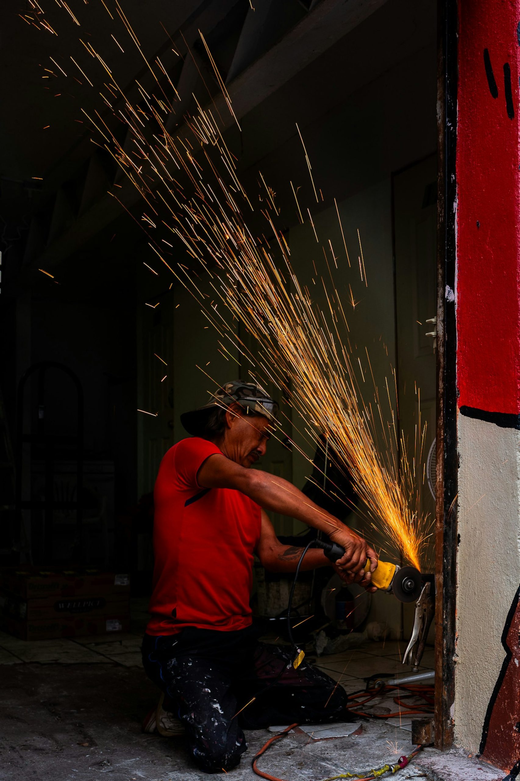 Tradesman using power tools on a job