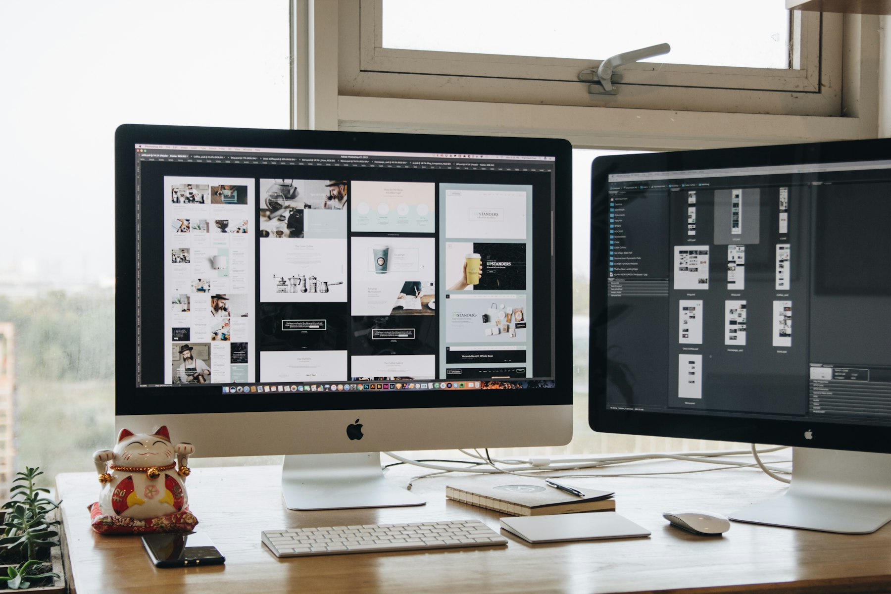 Two computer monitors showing website analytics