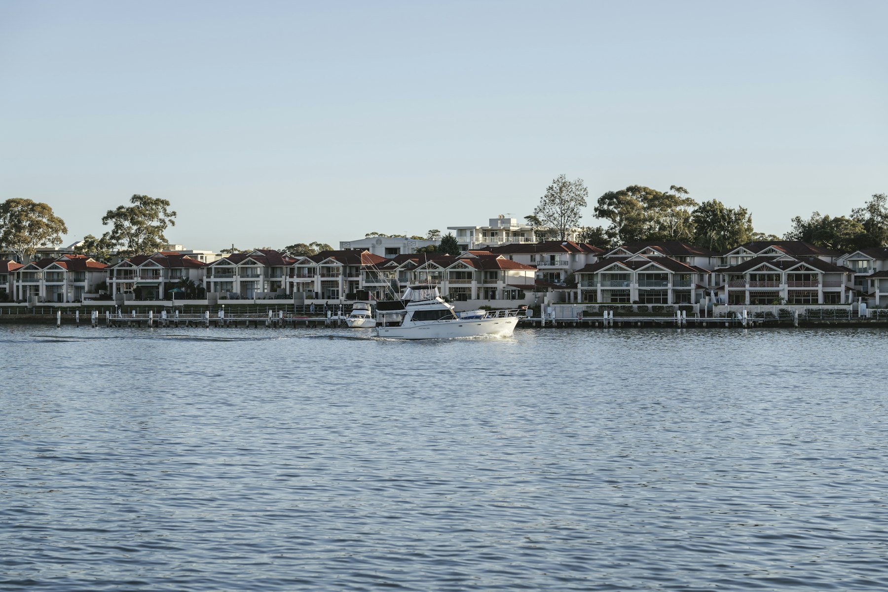 Houses along a calm stretch of water
